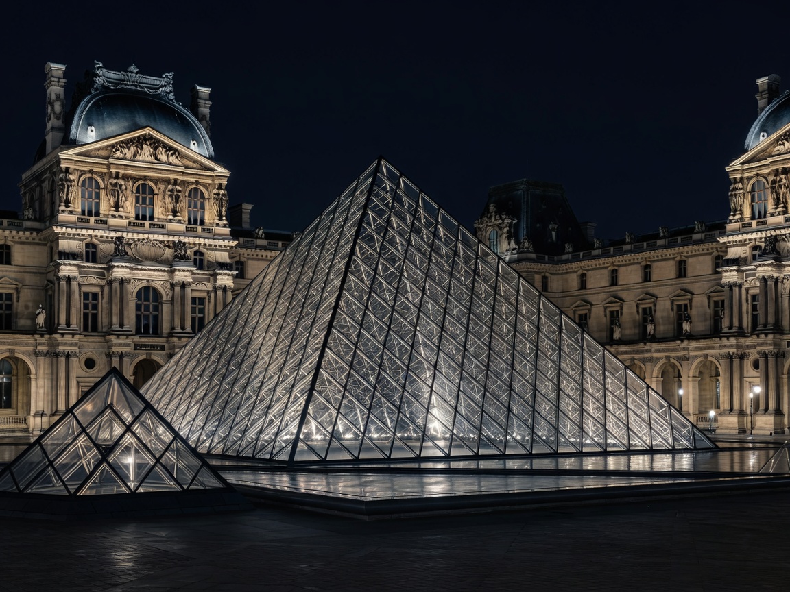 Louvre pyramid glowing at night
